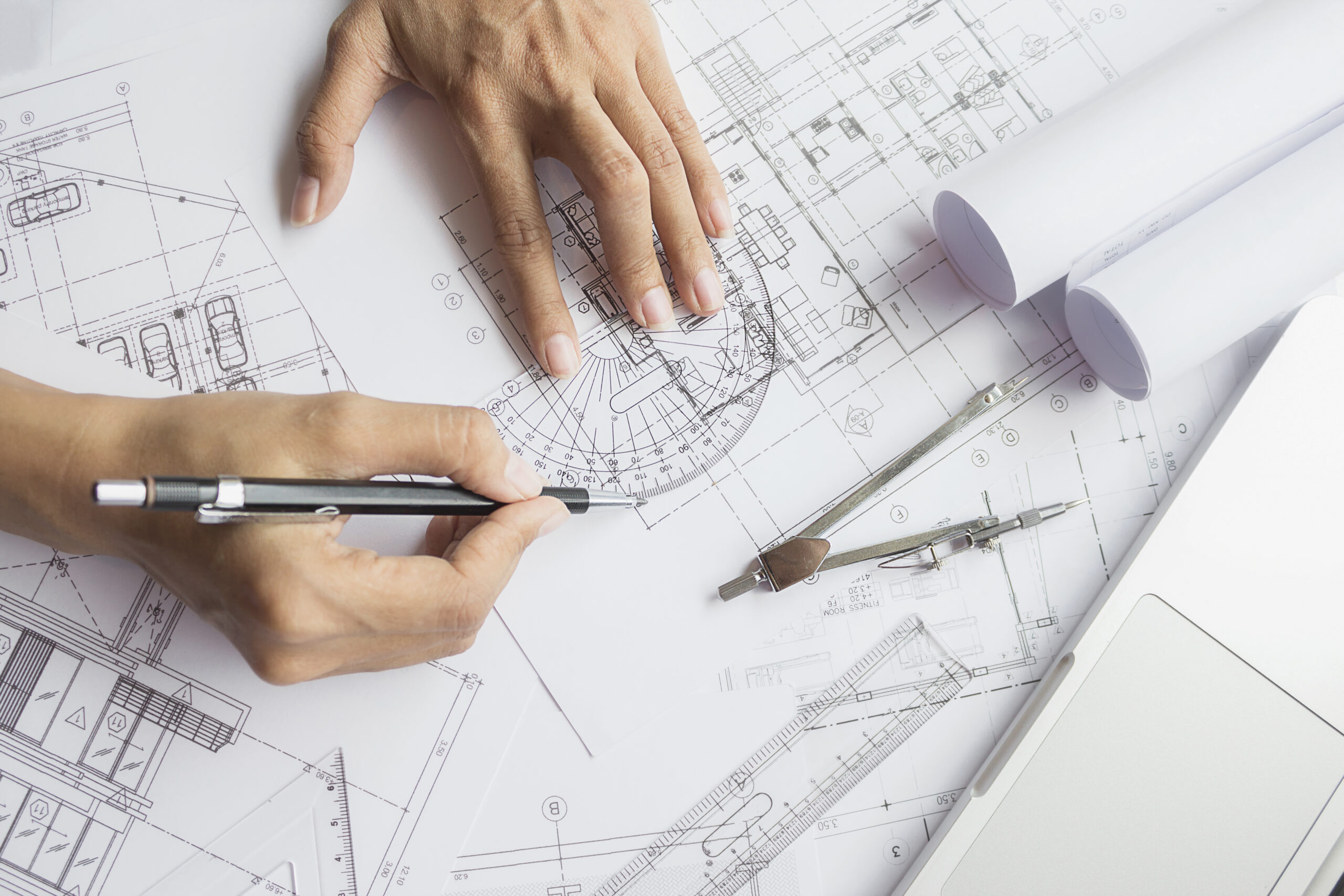 Hands of Engineer working on blueprint,Construction concept. Eng